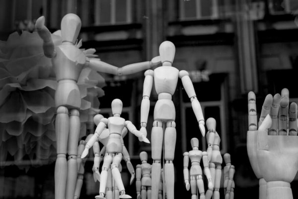 A group of wooden dolls represents the goodness of man.