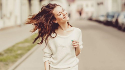 Woman smiling while walking.