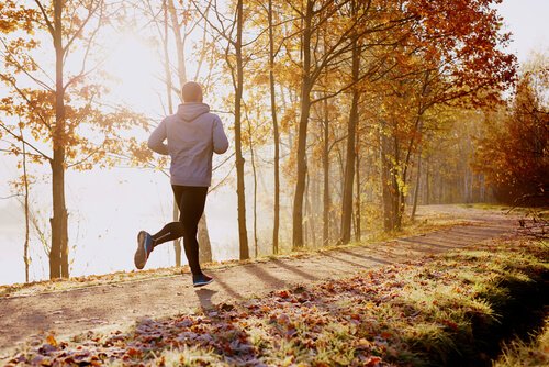 A man running in the woods.