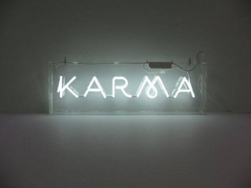 Sign that lights up that says karma.