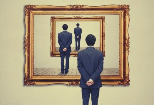 Man looking into multiple mirrors.