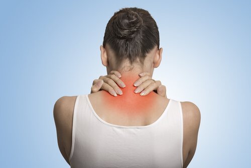 Woman with back pain from fibromyalgia.