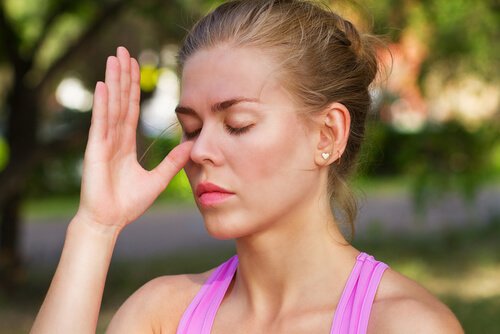 Woman doing breathing exercise.