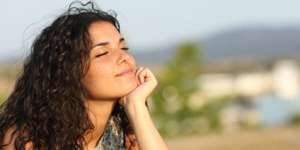 woman thinking with eyes closed