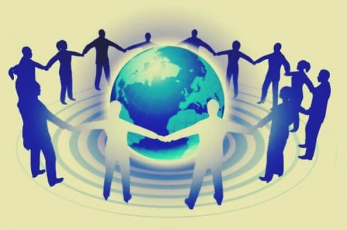 People holding hands around the globe.