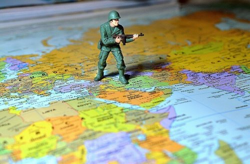 A soldier on a world map.
