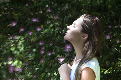 Woman practicing deep breathing.