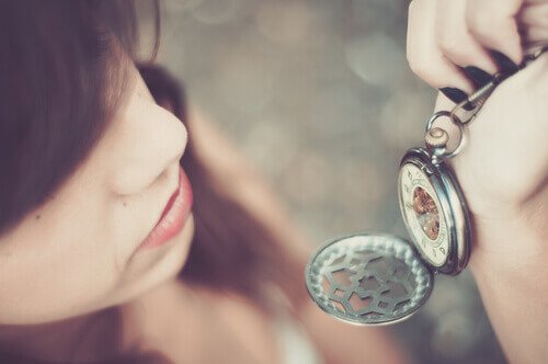 A woman looking at a watch as a means of control.