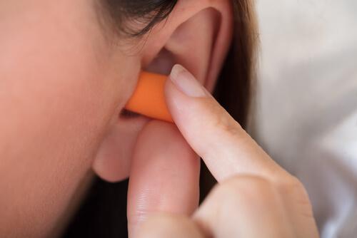 A woman who uses earplugs to sleep.