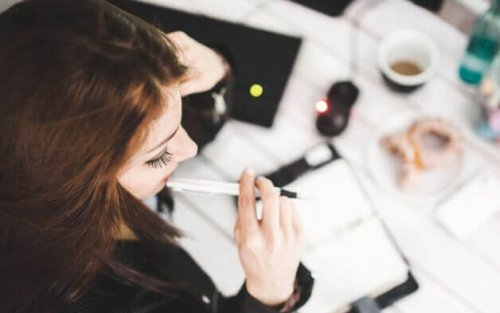 Woman thinking at work.