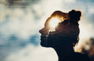 The shadow of a woman with the sun reflecting on it.
