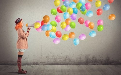 A clown woman with megaphone.