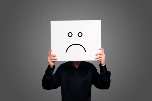 A pessimist holding a sign.
