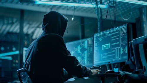 Man working on computer.
