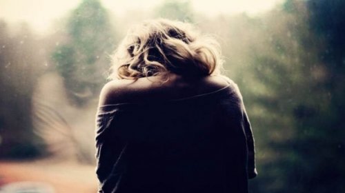 A woman with her back turned.