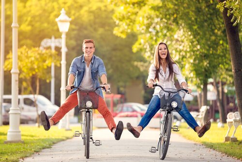 A couple riding bicycles.