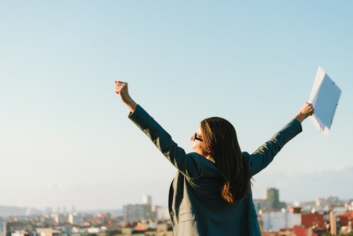 A woman celebrating her engagement at work.