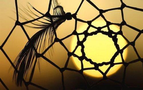 A dream catcher has a gap in the center.