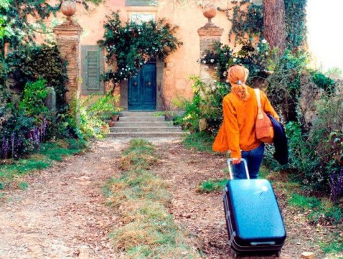 Starting over after a divorce: Frances with a suitcase entering an abandoned villa.