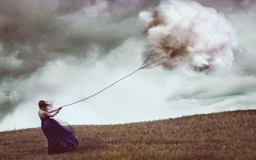 Girl dragging cloud.