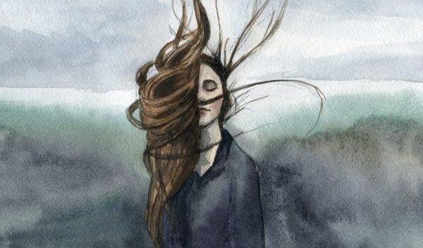 A girl with her hair in the wind.