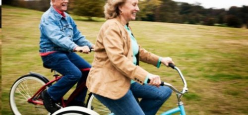 Two seniors riding bikes.
