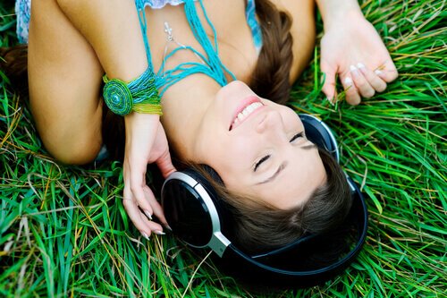 A woman listening to music.