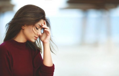 A woman looking stressed and worried.