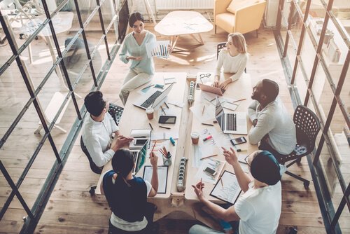 Group of co-workers in a meeting representing good internal communication.