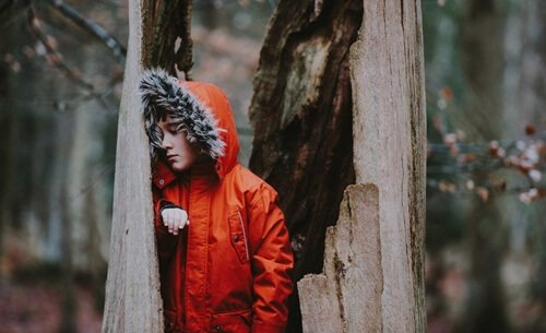 Boy in red jacket with emotionally negligent family
