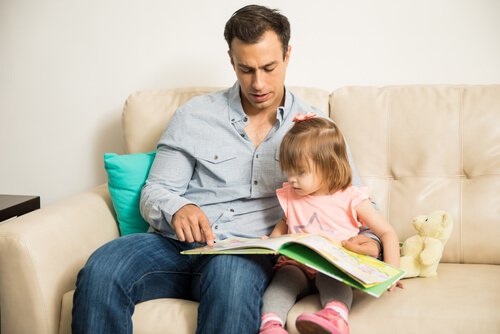 father reading with his daughter