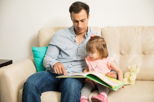 Father reading with his daughter. 