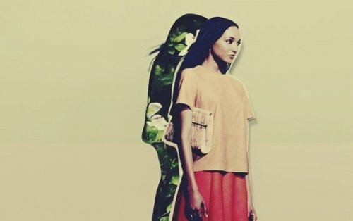 A girl and her shadow behind her.