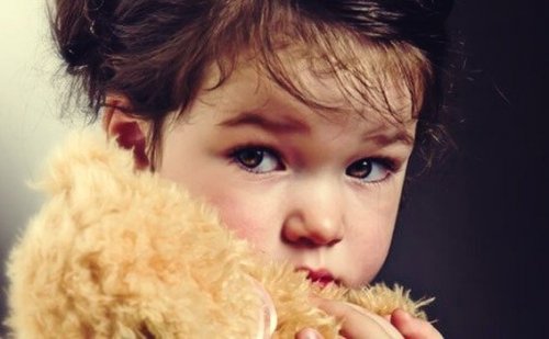 girl holding a teddy bear