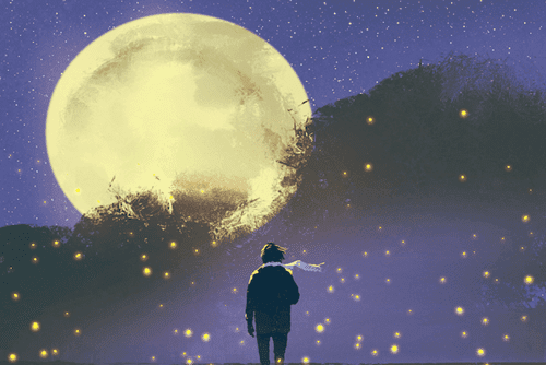 A guy with a scarf looking at the moon.