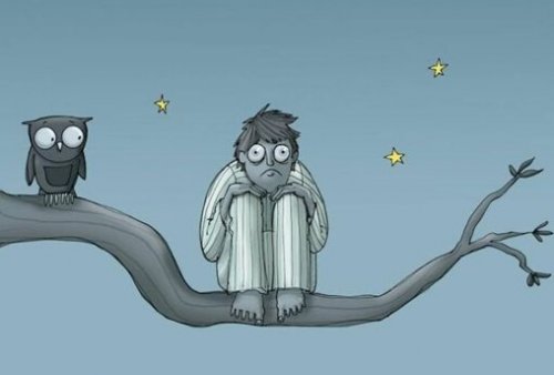 A boy, wide awake, next to an owl.