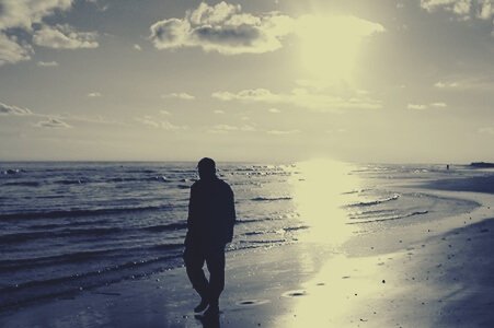 Man walking on the beach.