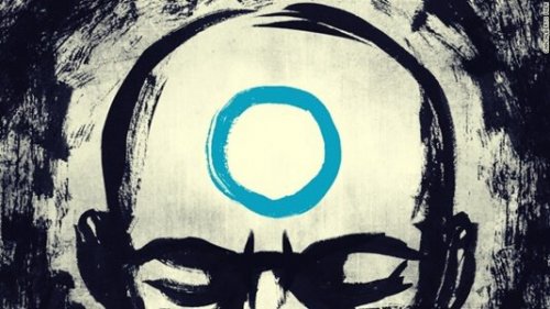 A Zen master with a circle on his head.