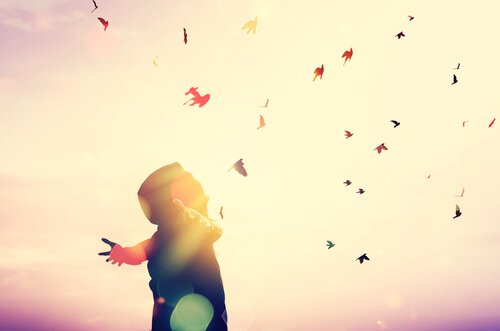 Man with his arms wide open saying "I'm going to fly high".