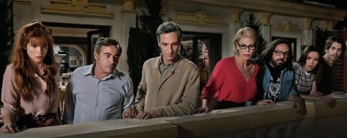 People looking out from balcony.