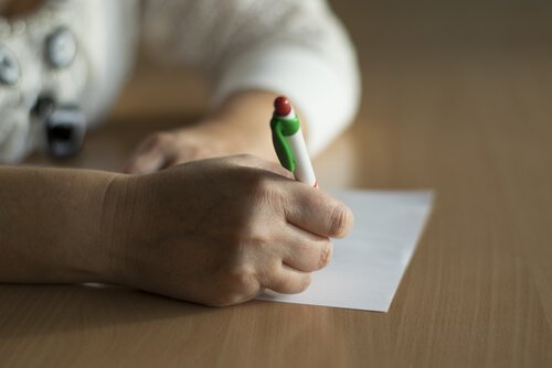 A patient signing an informed consent.