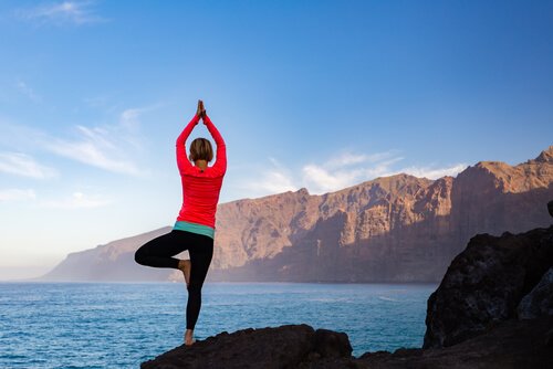 Woman doing tree pose.