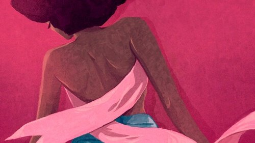 A woman with a pink breast cancer ribbon as a shirt.