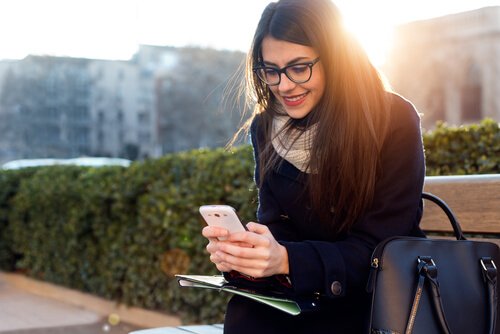 Woman using her mobile phone.