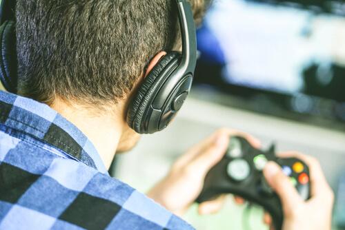 A boy playing video games.
