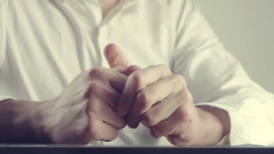 Fidgety hands are a sign of the body language of anxiety.