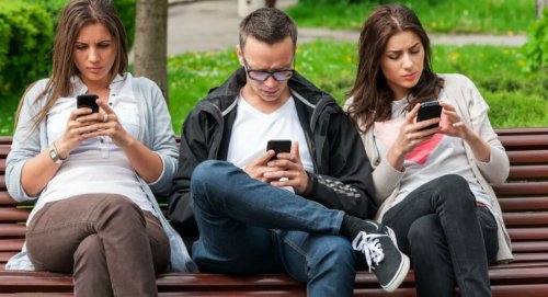 Friends on their phones.