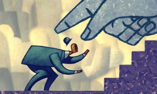 A giant hand scolding a man in a suit.