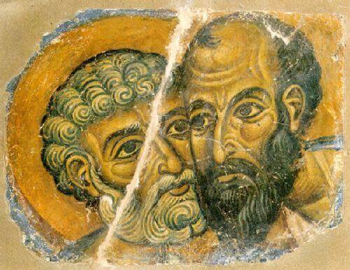 Two men pressing their faces against each other's.