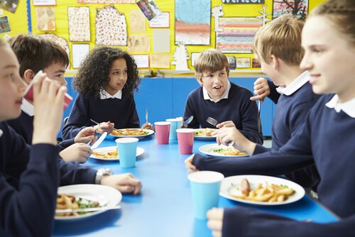 Children can learn table manners in the school cafeteria.